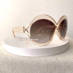 Clear frame oval sunglasses for women "Malta" with brown lenses - side view